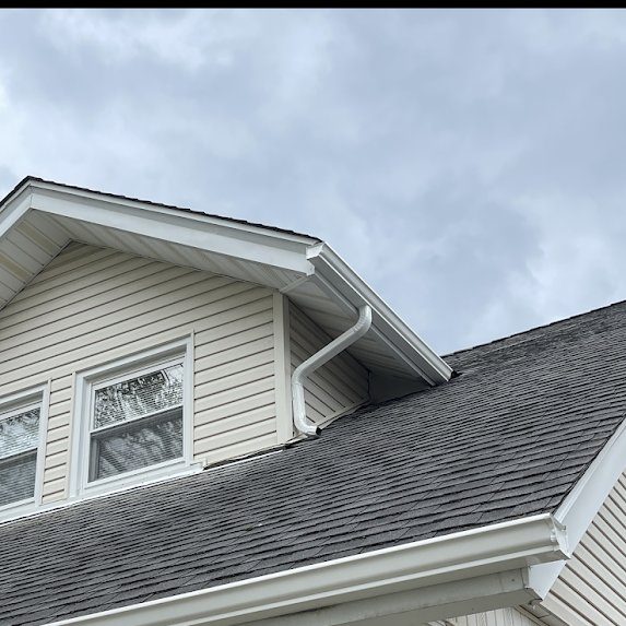 Downspout transition between roof levels