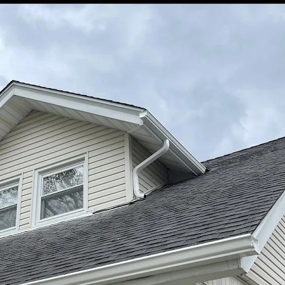 Downspout roof transition detail showing proper drainage path