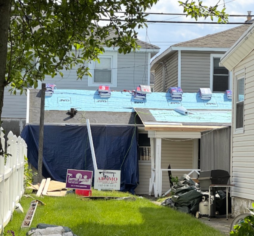 Bradley Beach roof mid-project — GAF Deck-Armor underlayment down, shingle bundles staged