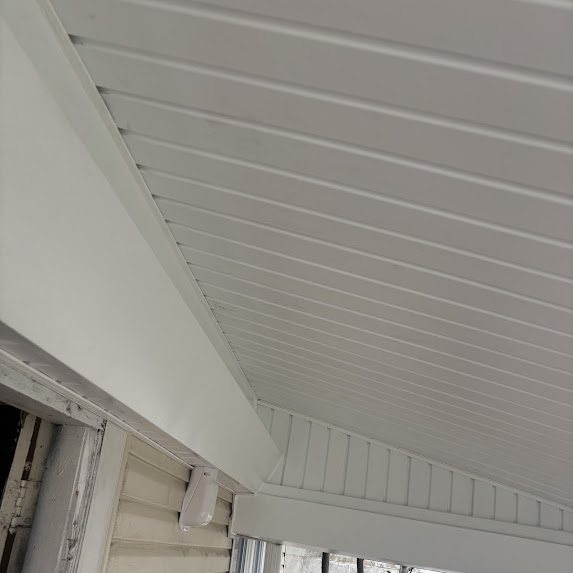 White soffit corner detail with J-channel on a Bradley Beach porch