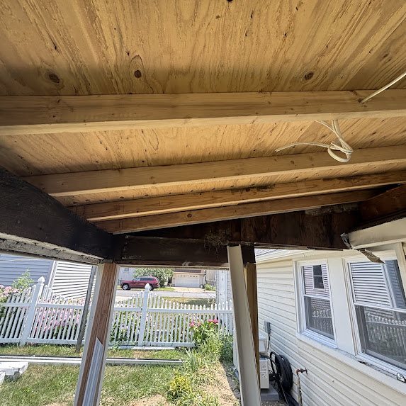 Overhang torn out to framing with new plywood decking during rebuild