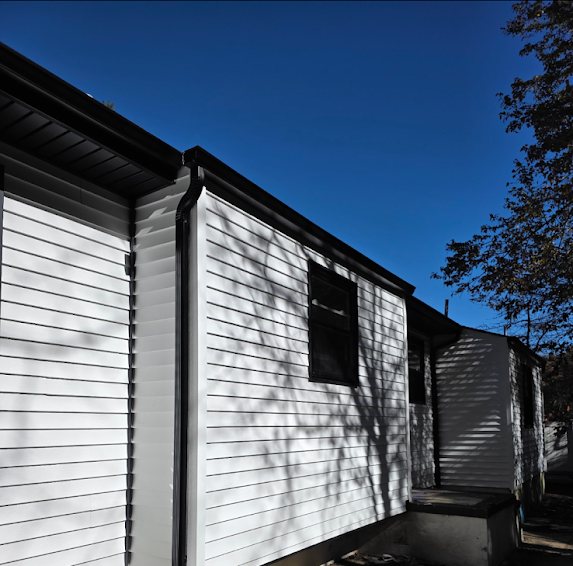 Brick New Construction: Black 5-Inch Gutters and 2x3 Downspouts for a Sharp, Finished Look