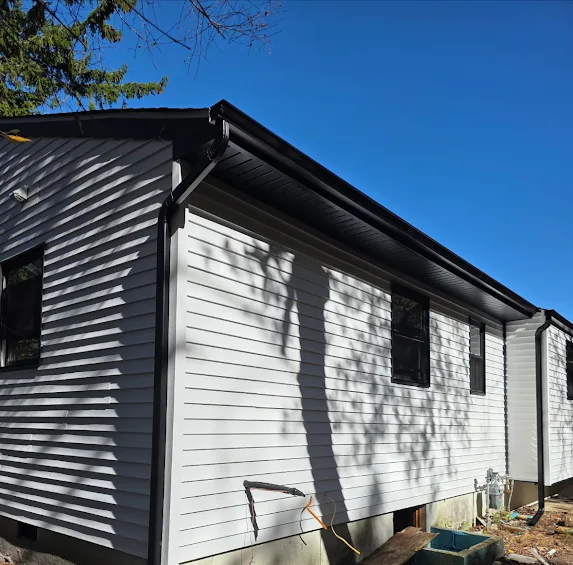 Brick New Construction: Black 5-Inch Gutters and 2x3 Downspouts for a Sharp, Finished Look
