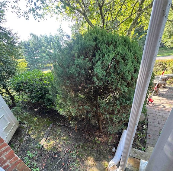 Yard beside a Marlboro home before underground drainage trenching