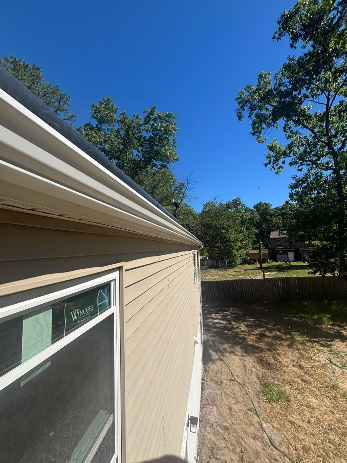 White gutter above new windows on a renovated ranch