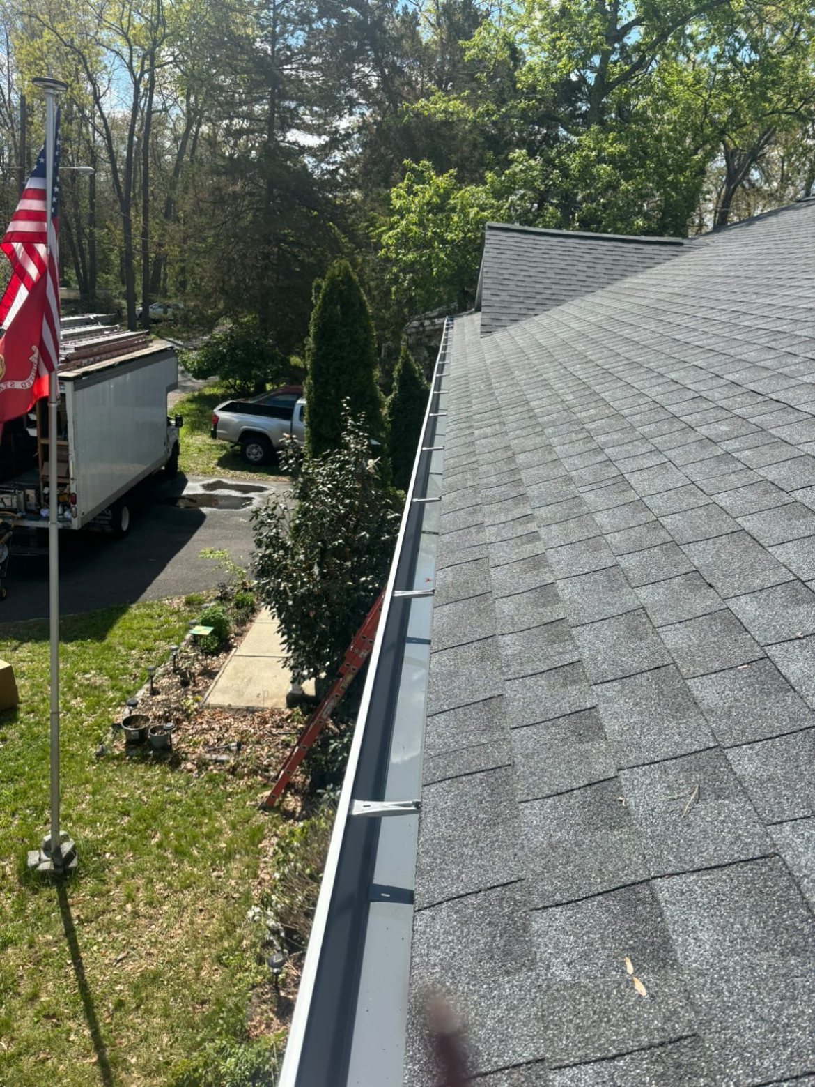 White gutter eave detail under a gray roof