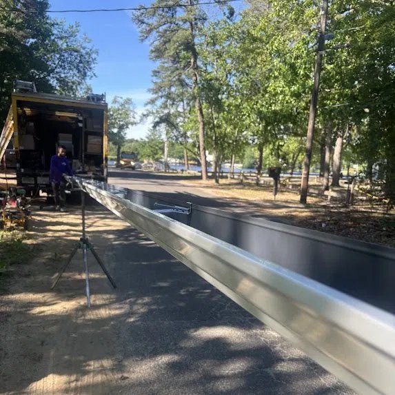 Seamless gutter roll-formed on-site to the exact run length