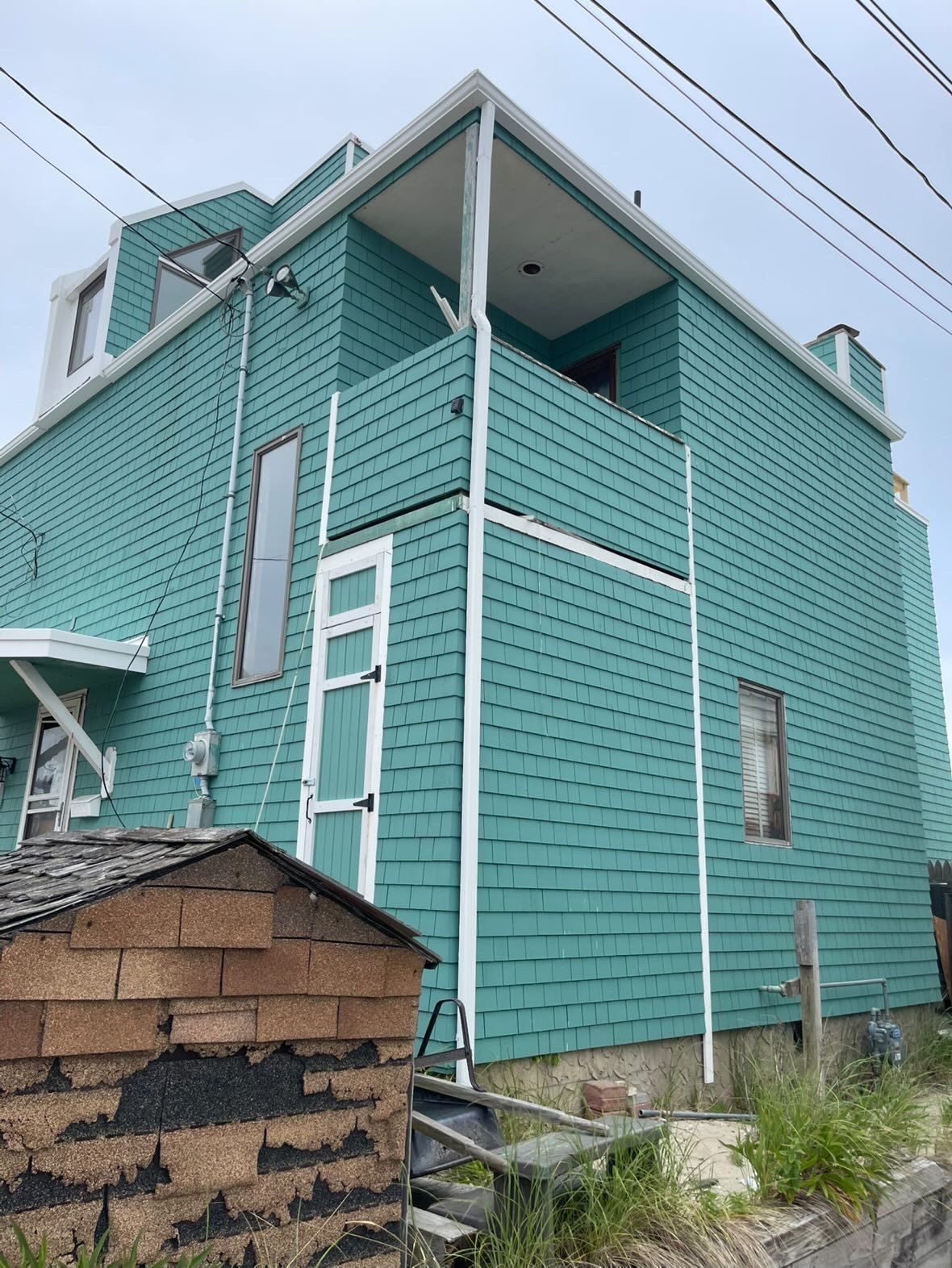 White 2x3 downspouts on a Point Pleasant Beach waterfront home