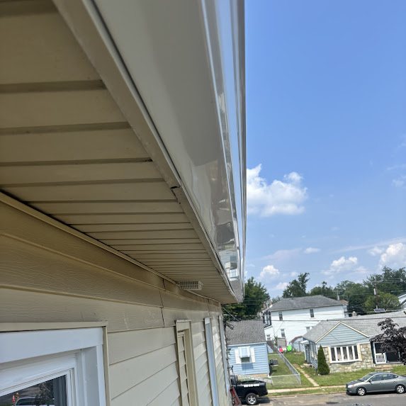 New white gutter running straight along an eave in Riverside NJ