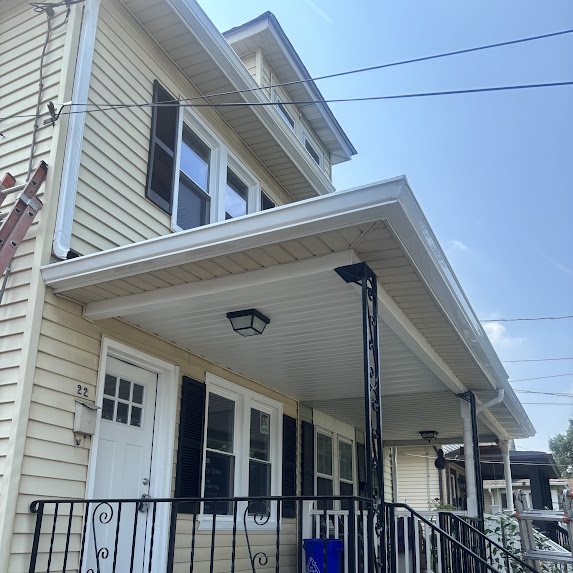 New white gutter line above a porch on a Riverside NJ home