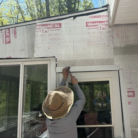 Gutter Bandits crew installing J-channel trim around sunroom windows in Millstone Township