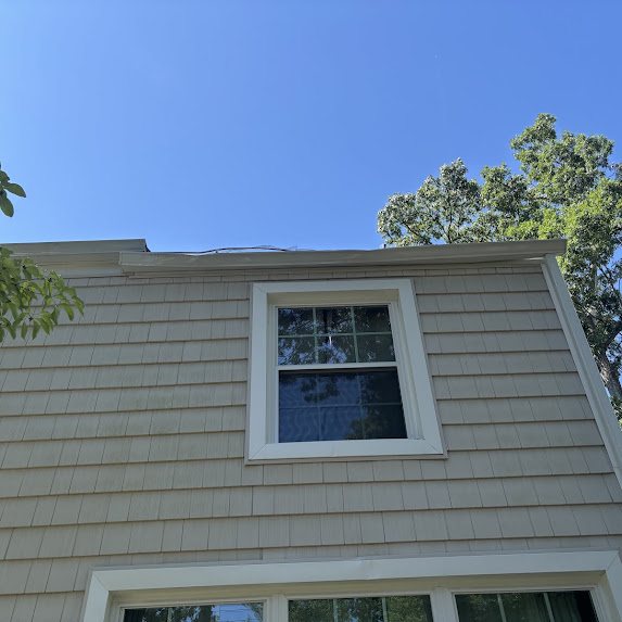 Roof edge with the storm-damaged gutter removed on a Spring Lake Heights home