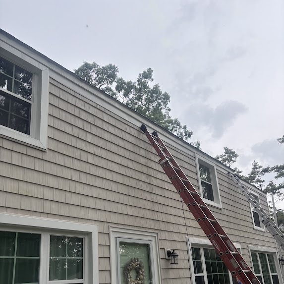 Ladders set against a Spring Lake Heights home during gutter replacement