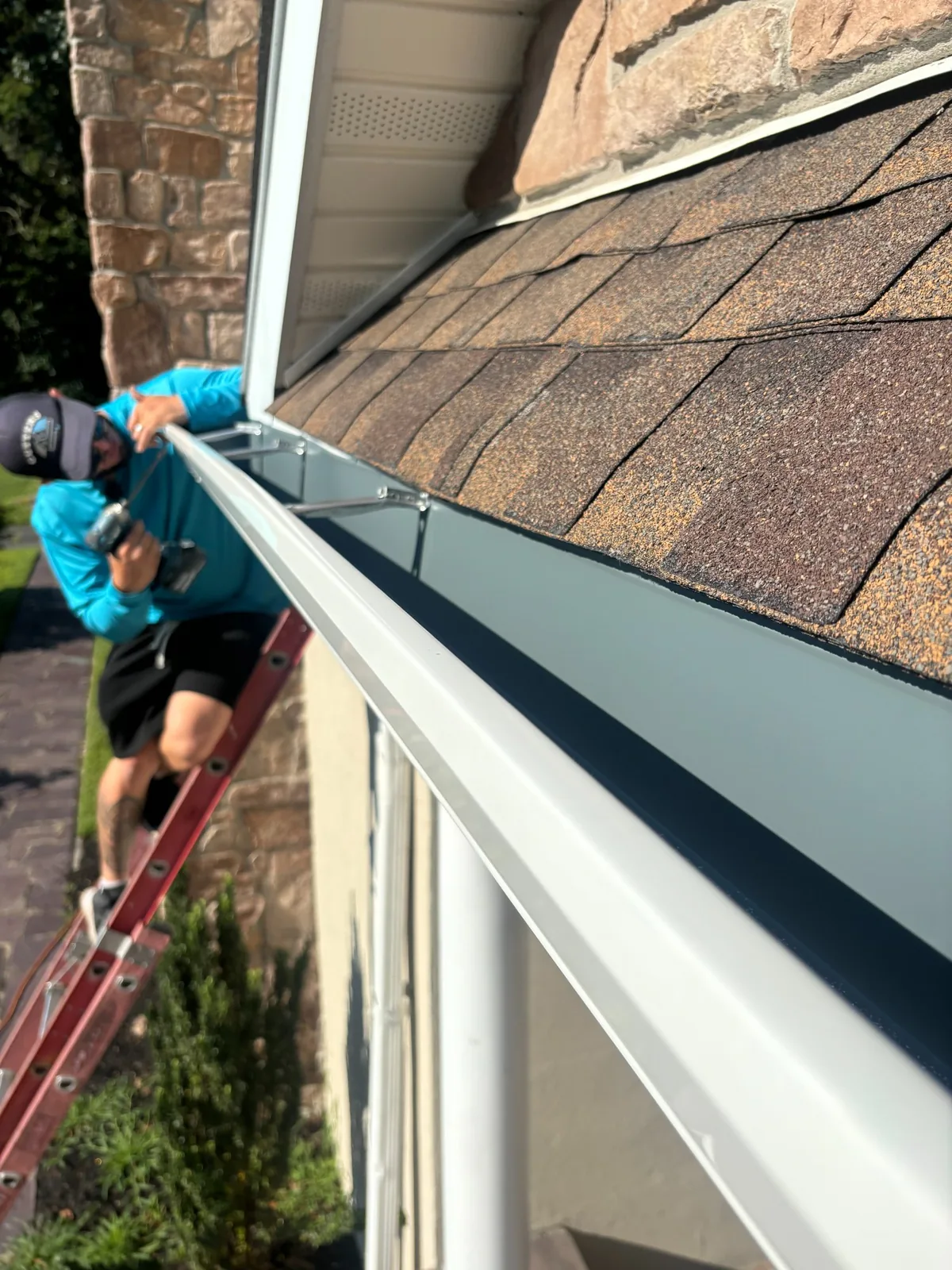 Gutter install on stone colonial